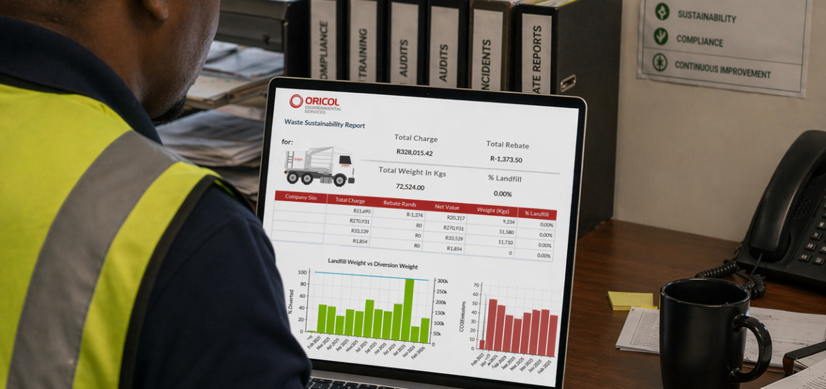 A compliance officer looks over a waste data report generated by Oricol Environmental Services.